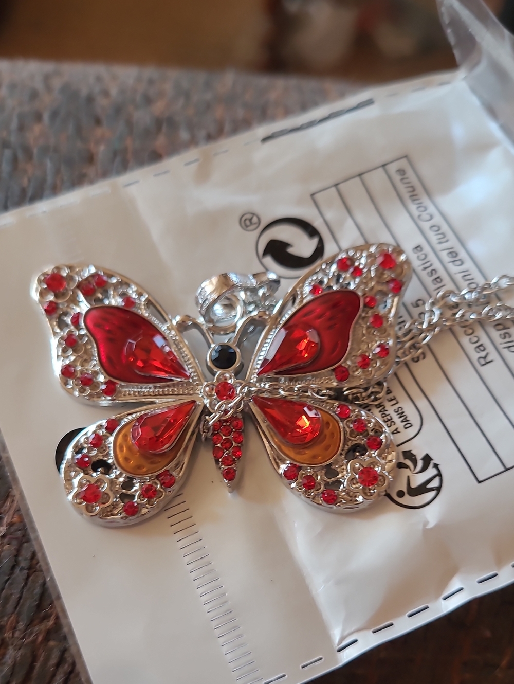 Silver Butterfly Pendant Necklace with Red and Amber Crystals